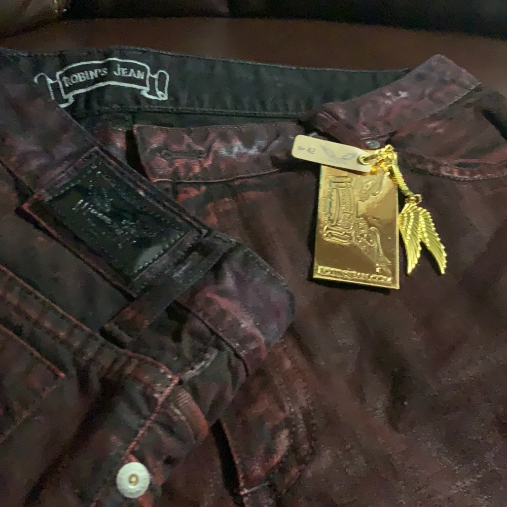 Burgundy/black gently used Authentic Robin’s Jeans